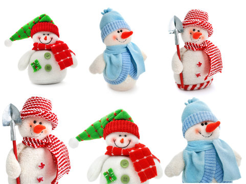 smiling snowman toy dressed in scarf and cap