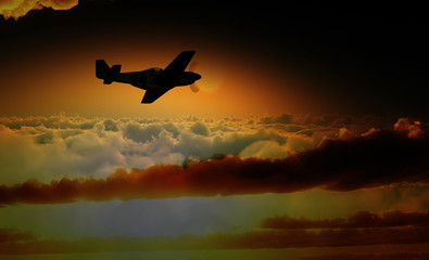 Fototapeta na wymiar Plane Over The Clouds