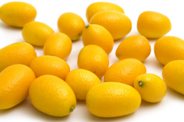 fresh kumquat on white background