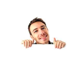 Young man behind a board