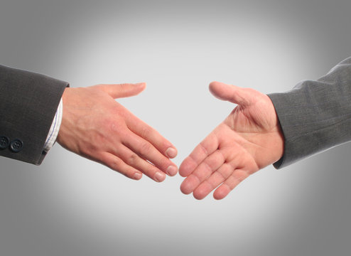 Business handshake with gray background