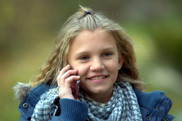 beautiful young girl talking on phone and smile