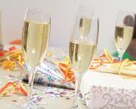 Glasses of champagne and gifts at a party