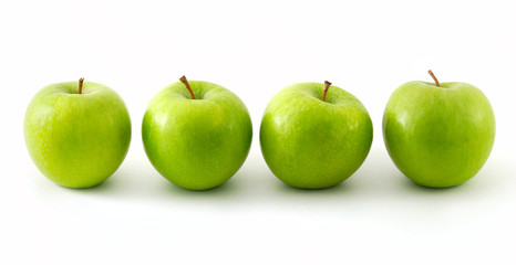 Four green apples in a row