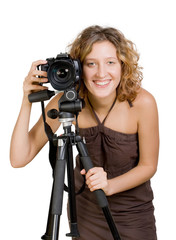 Young beautiful smiling woman holding a photo camera