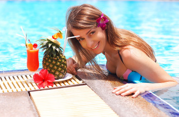 Girl in tropical pool