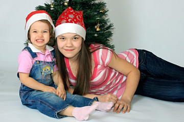 Sisters are in new-year caps.