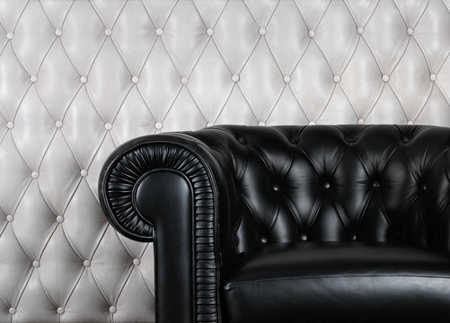 Black Leather Armchair Near White Wall