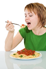 Happy woman eating pasta