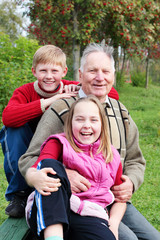 Fototapeta na wymiar grandfather with children outdoor