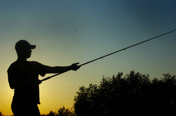 fisherman on sundown