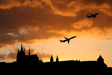 planes departing Prague at sunset