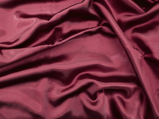 Natural red satin fabric texture background