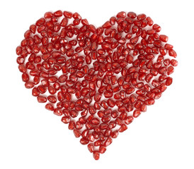 Obraz na płótnie Canvas Valentine's heart shape made by pomegranate seeds