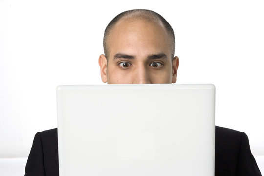 Man stares at his laptop screen