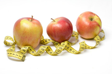 Red apple and tape measure
