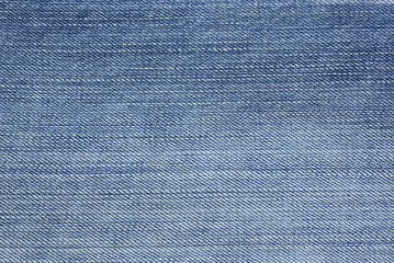 Light blue jeans foto as backdrop or abstract textured backgroun