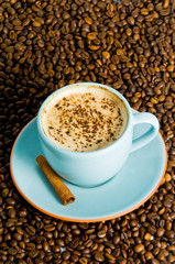 cappuccino on white background with coffee beans