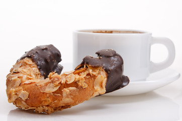 Single fresh croissant with coffee