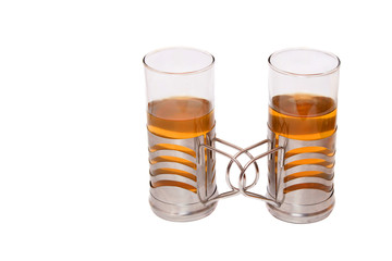 Two glasses of tea  isolated on white.