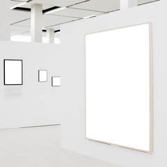 Big empty frame on white wall exhibition