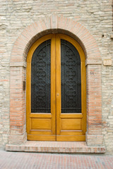 Elegant old door in San Gimigliano Tuscany Italy