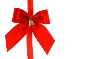 Big red holiday bow with bell on white background