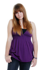 Shy teenager wearing a purple top and black jeans