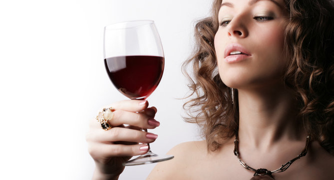 Beautiful woman with glass red wine