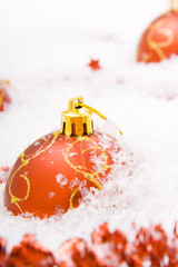 Christmas balls in snow isolated on white