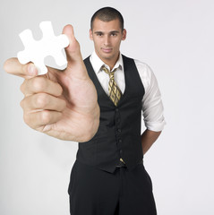 businessman holding puzzle piece