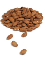 It is a lot of nuts of almonds on a white background
