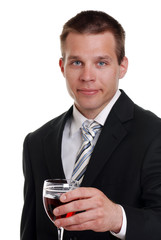 young man holding a glass of red wine