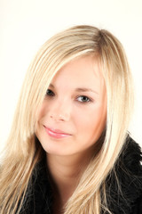 Naklejka premium Very attractive teenager is looking directly into camera