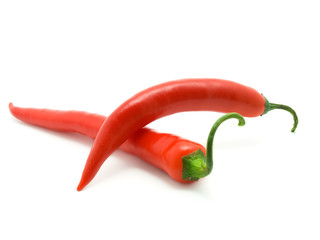 two Pod of red peppers on white background