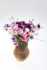 Naklejka na ściany i meble Flowers in ceramic vase
