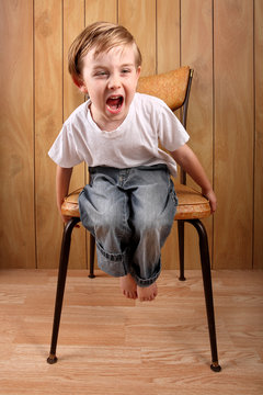 Boy Throwing A Tantrum While On A Time Out