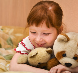 Redheaded nice girl with teddy bears