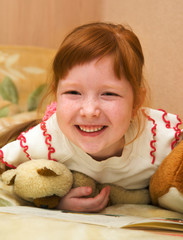 Redheaded nice girl with teddy bears