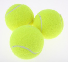 three tennis balls on white background