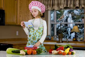 child reading recipe