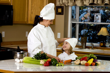 Mother Daughter cooking dinner