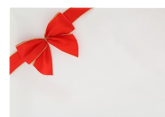 .Red holiday ribbon bow on white envelope