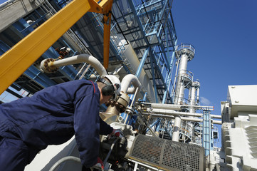 checking oil refinery equipment