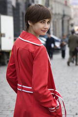 young pretty girl in red coat