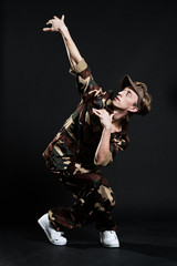 handsome breakdancer in military uniform
