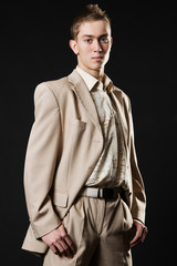 young businessman in beige suit