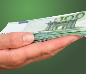 Hand with euro isolated on background