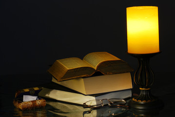 Old Lamp and Books with reading glasses