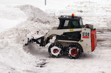 Cleaning street from snowstorm